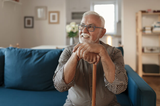 An older patient learning about dental care for pensioners and implant options at Adelaide DentalCare on Grenfell Street in the Adelaide CBD.