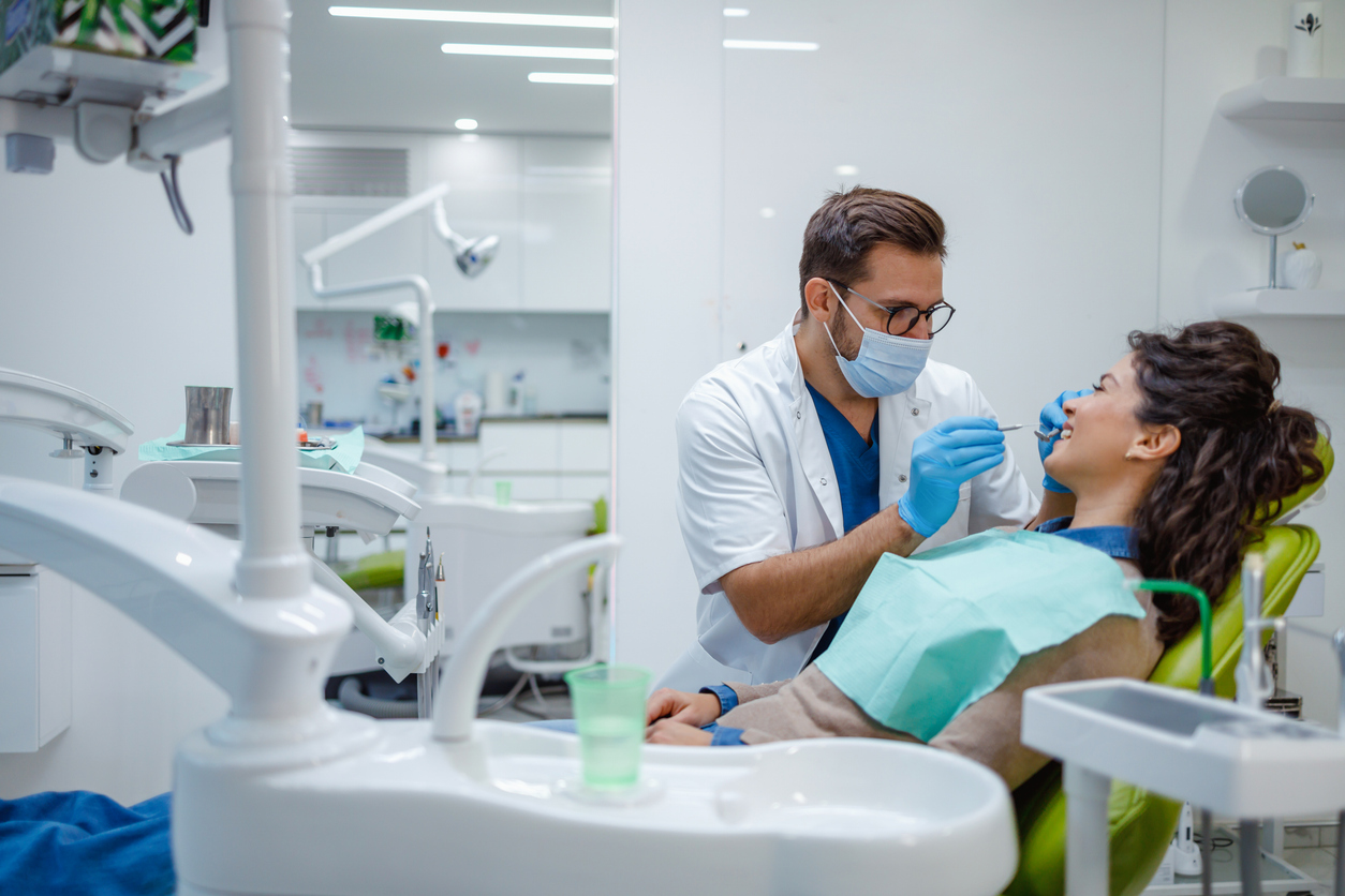 Dentist performing a checkup on patient